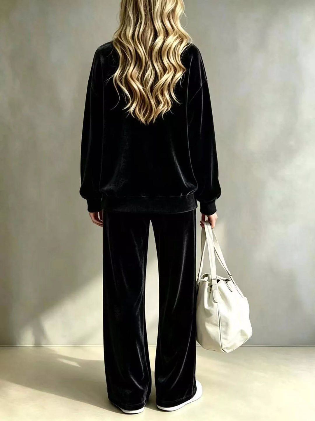 Black lounge set back view showing the pullover and long wide leg pants