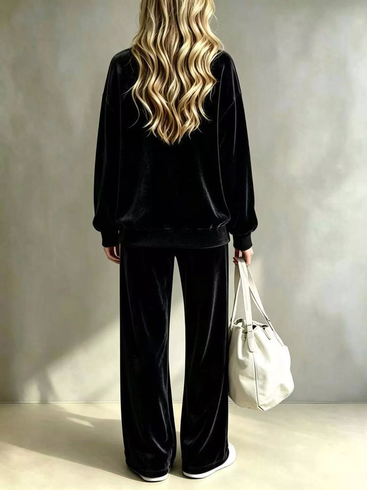 Black lounge set back view showing the pullover and long wide leg pants