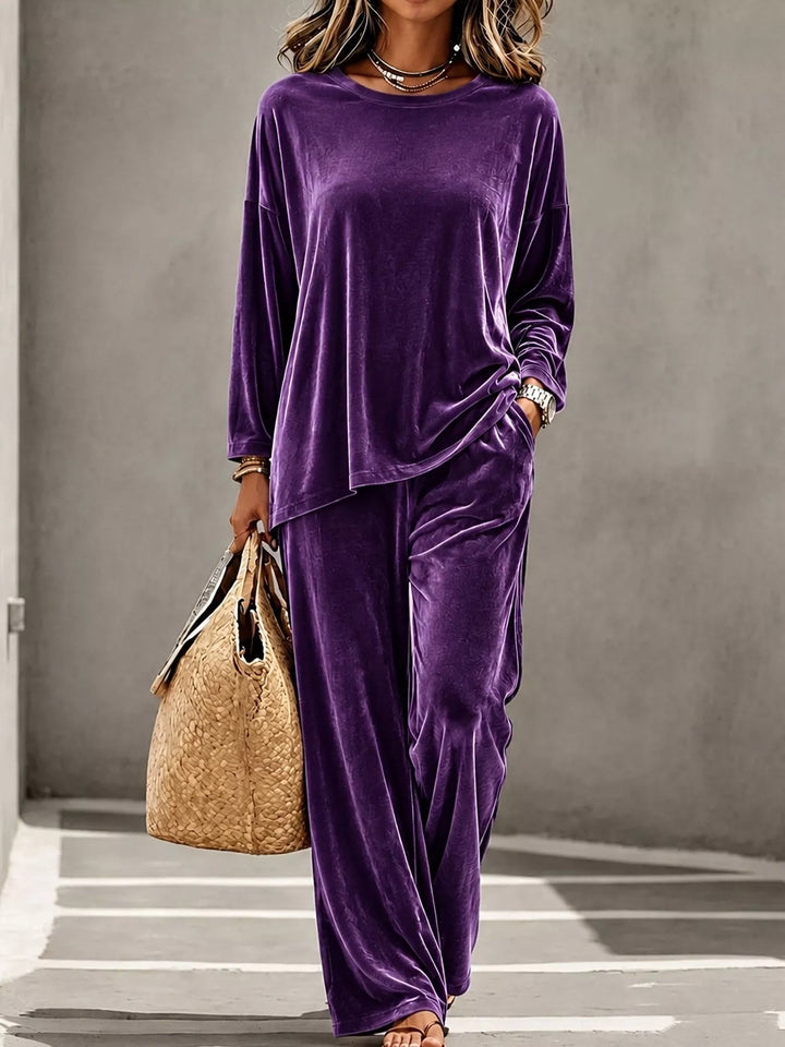 Purple velvet lounge set with wide leg pants, full length walking pose