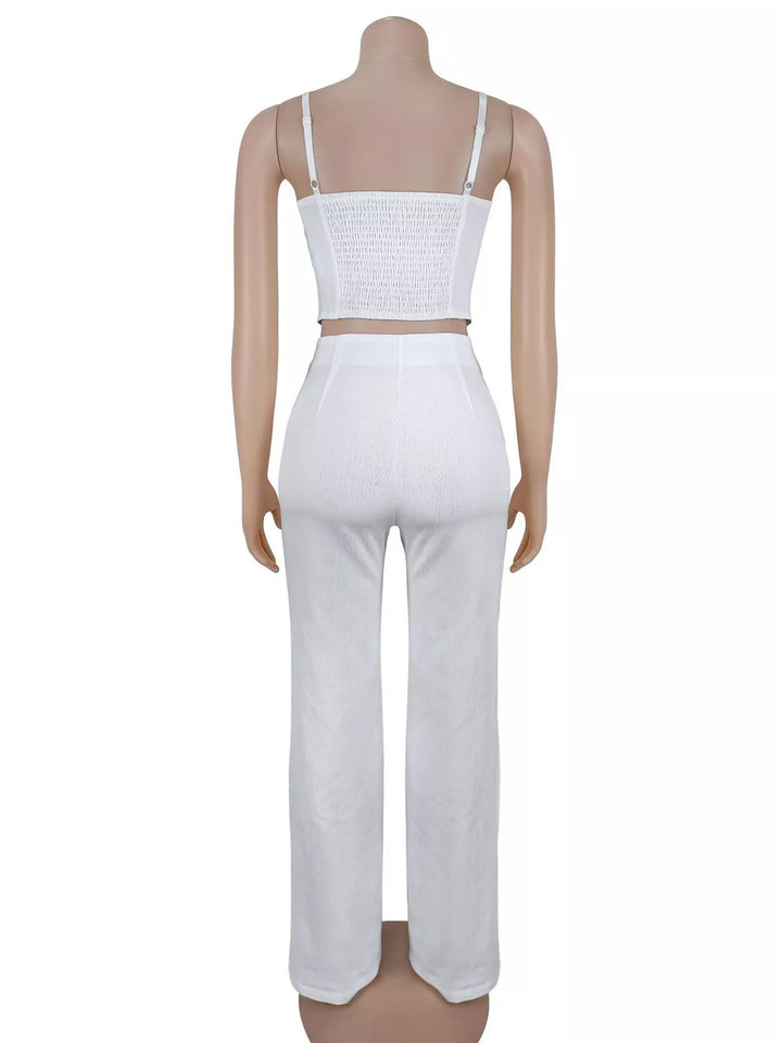 White cami top and pants set seen from behind on a mannequin