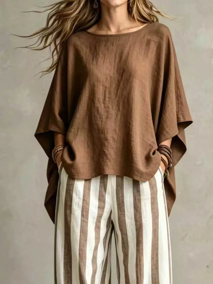 Brown matching set top with draped batwing sleeves, closer front view