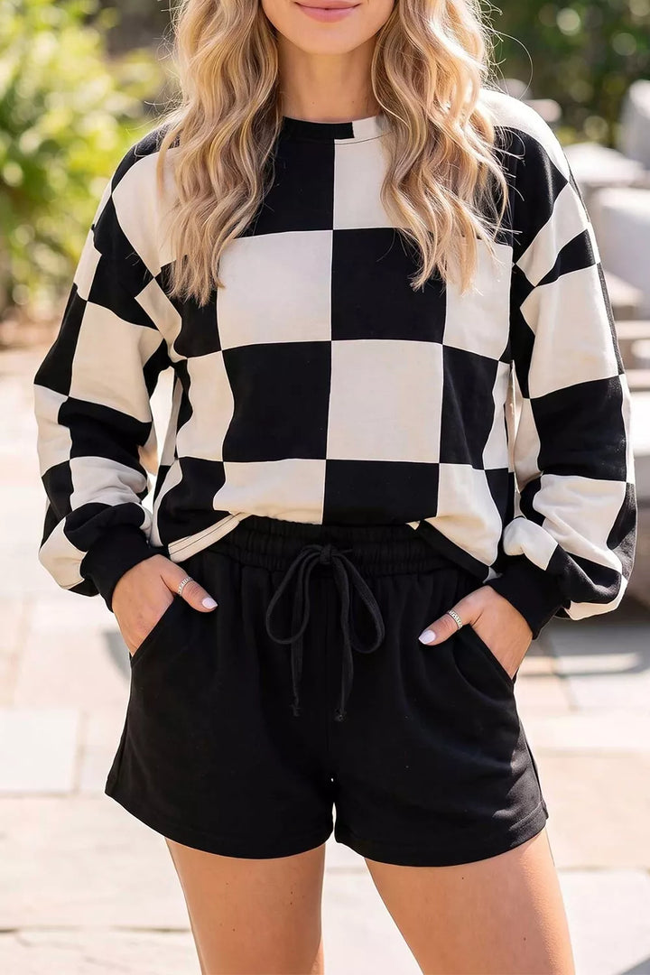 Women's matching set with checkerboard top and black drawstring shorts, front view