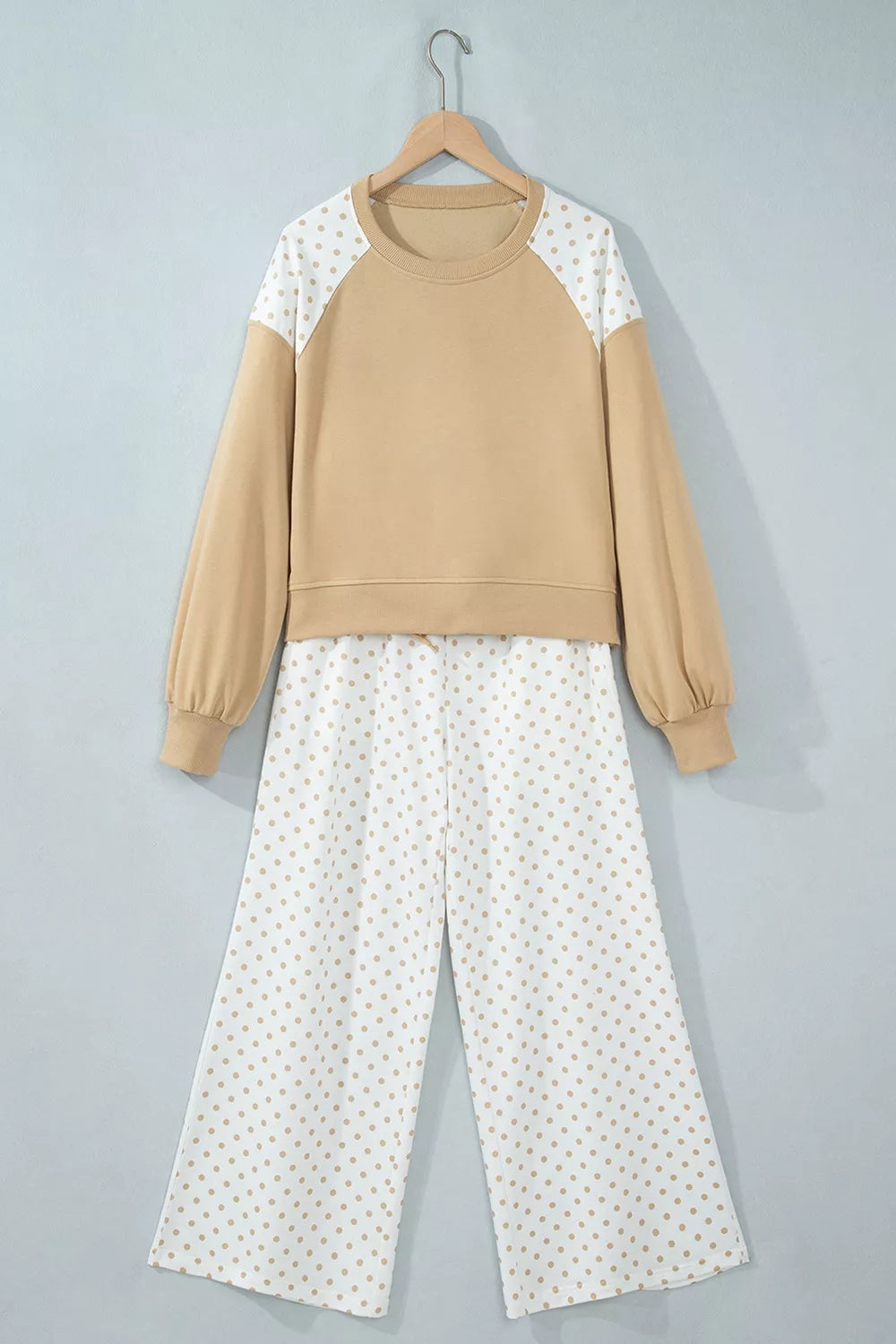 Hanging view of the tan matching set with polka dot sleeve panels