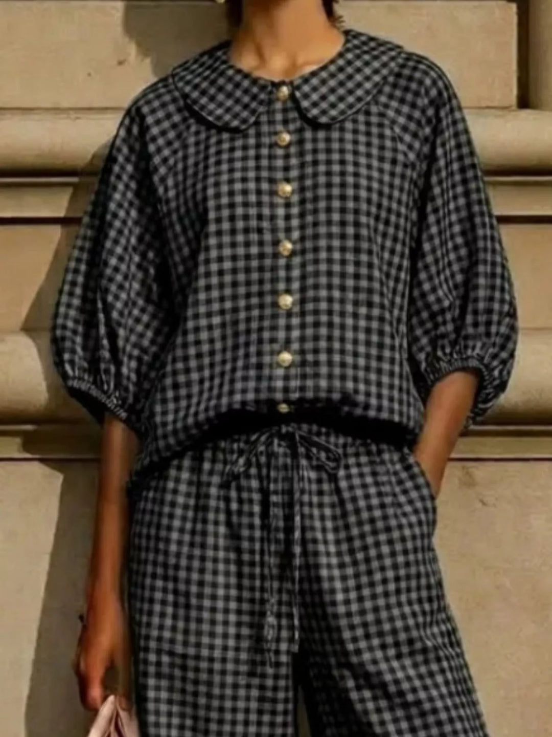 black gingham top detail with puff sleeves and tied drawstring waist