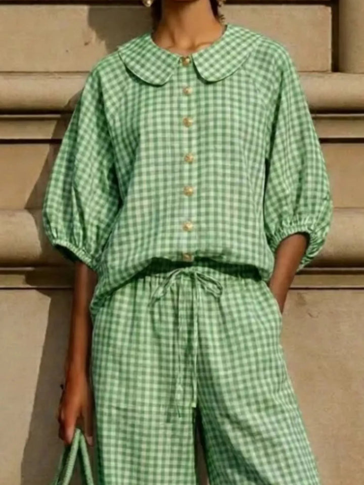 Close-up of green gingham collar, button placket and sleeves