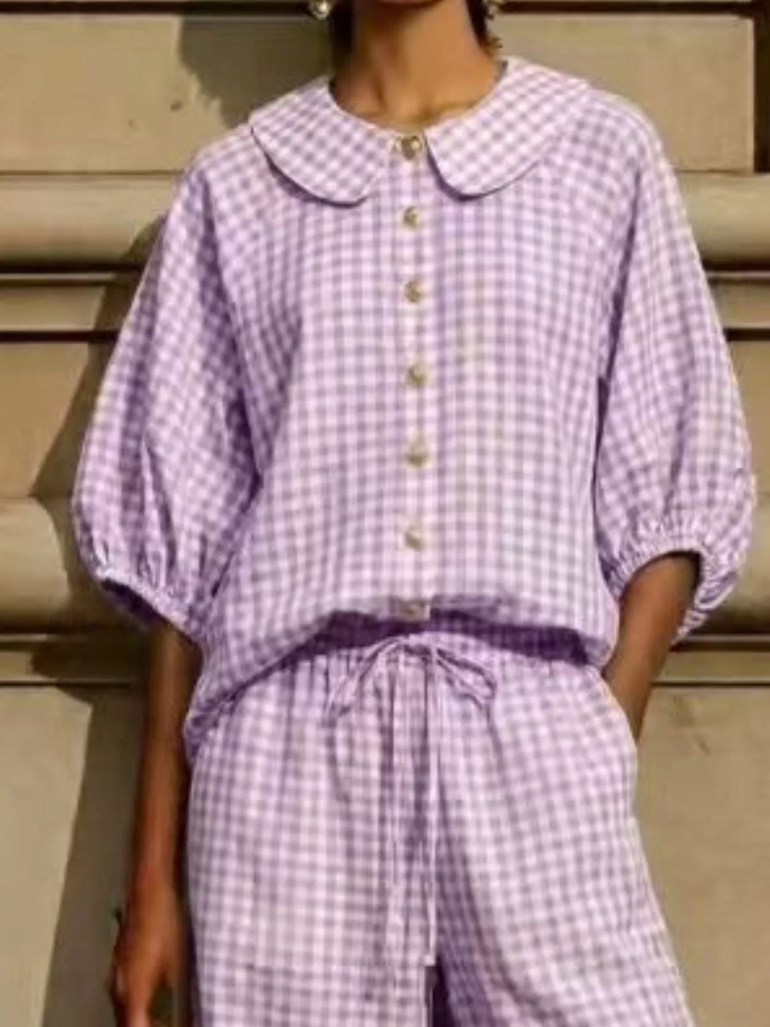 Detail of lavender gingham top with button front and drawstring pants