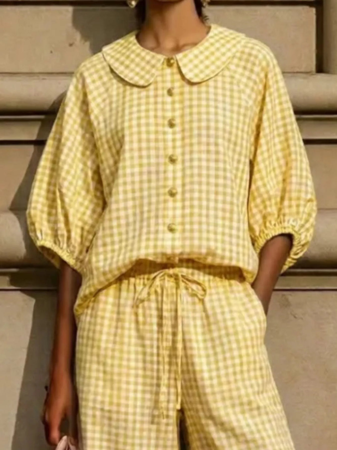 Detail of yellow gingham Peter Pan collar top and drawstring waist