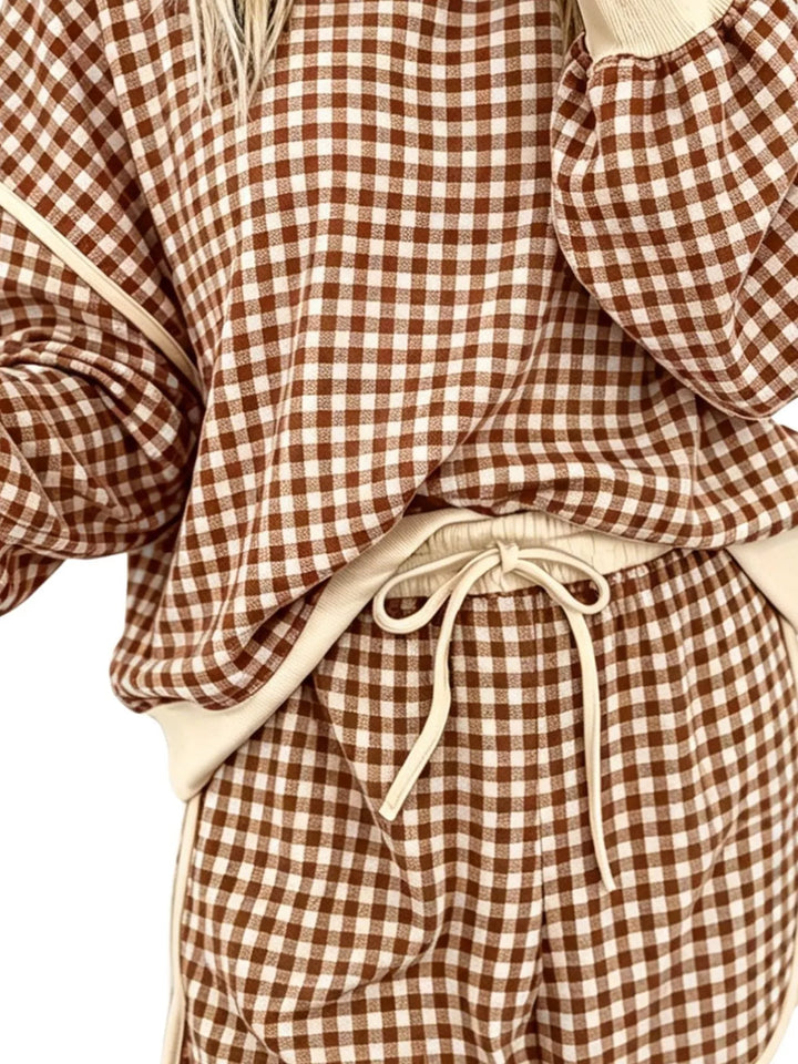 Close-up of the brown check shorts waistband with cream drawstring