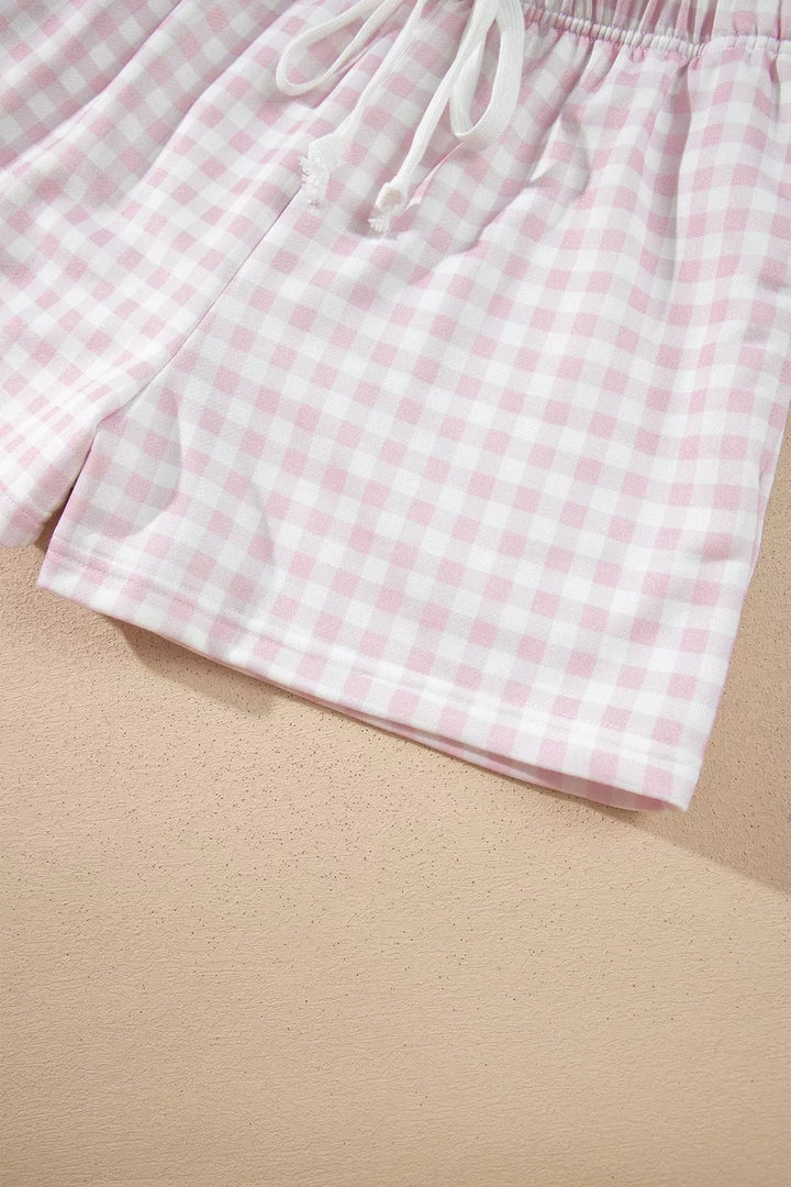 Side view of the gingham drawstring shorts with the pocket opening