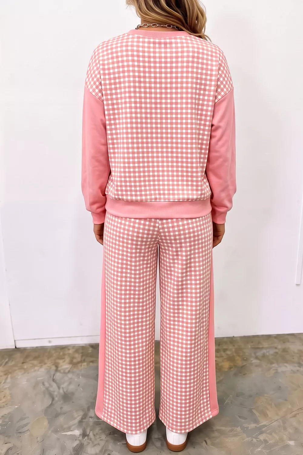 Back view of the coral pink gingham sweatshirt and wide leg pants set