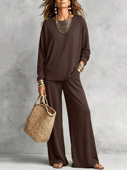Chocolate brown long sleeve tee and wide leg pants with a straw tote