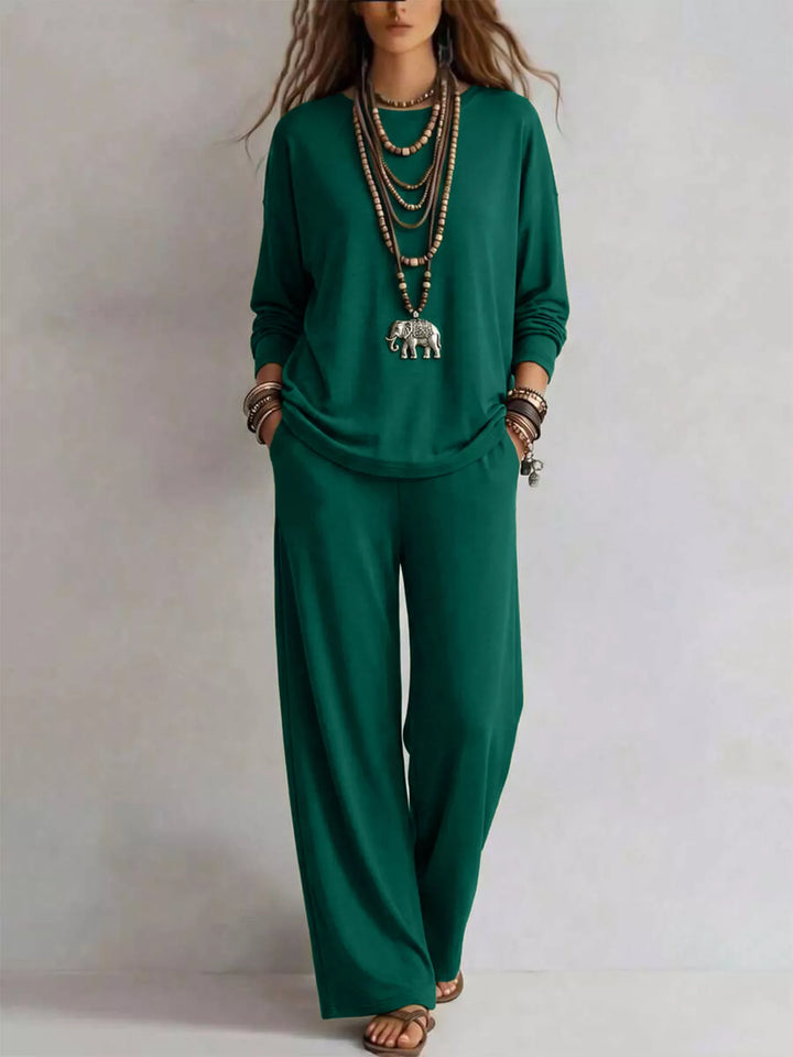 Emerald green long sleeve tee and wide leg pants, standing front view