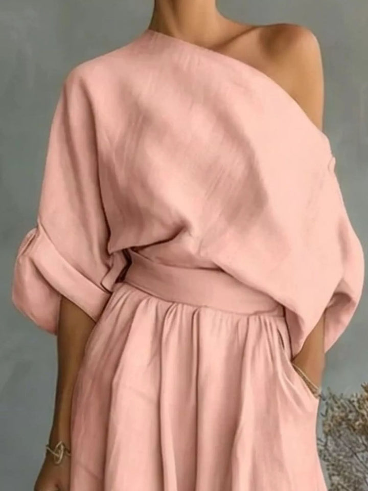 Closer view of the blush one shoulder top with a cinched waist