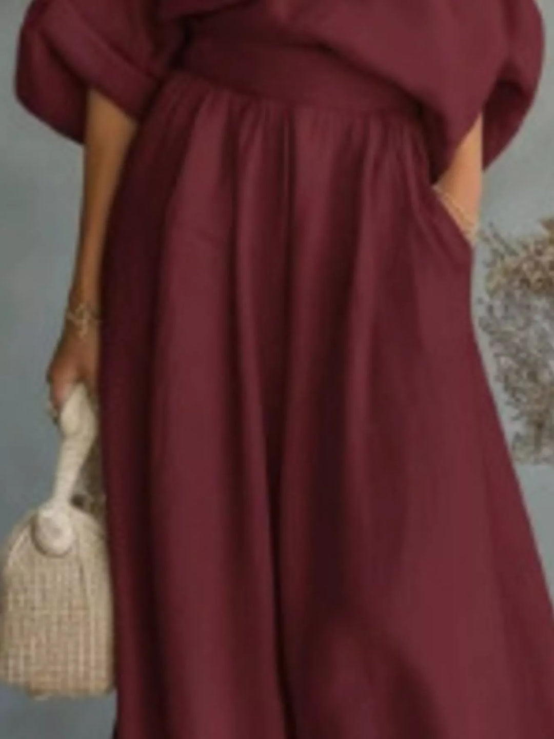 Burgundy wide leg maxi pants with front pocket and woven bag