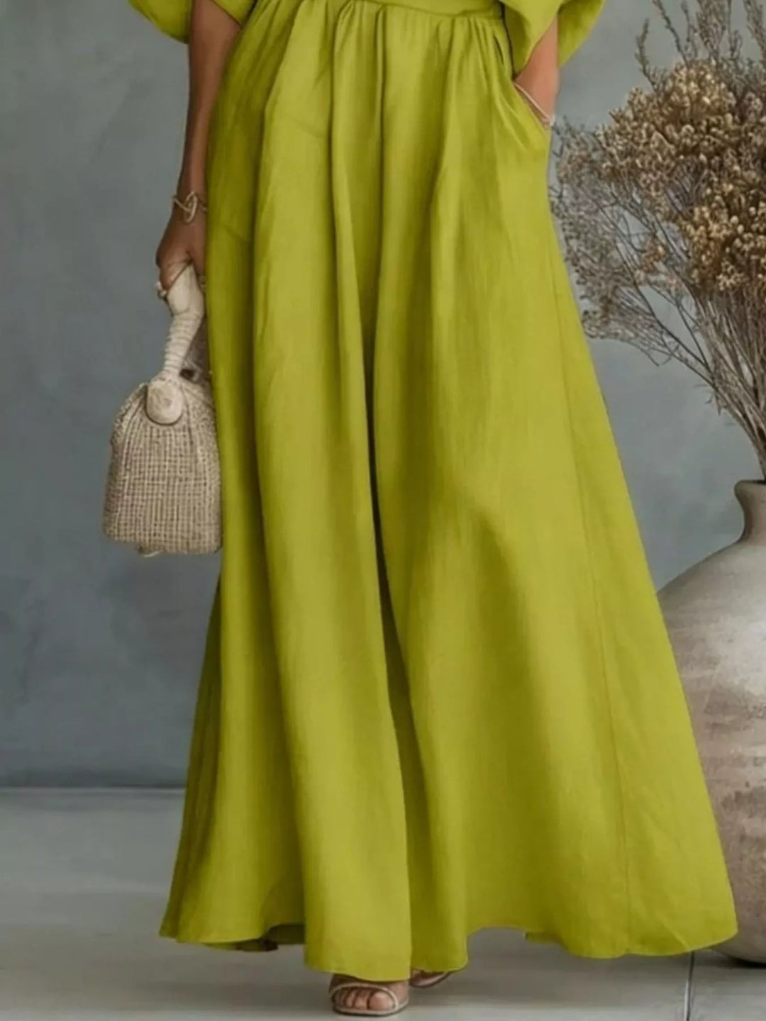 Chartreuse wide leg maxi pants with pocket and woven bag, lower view