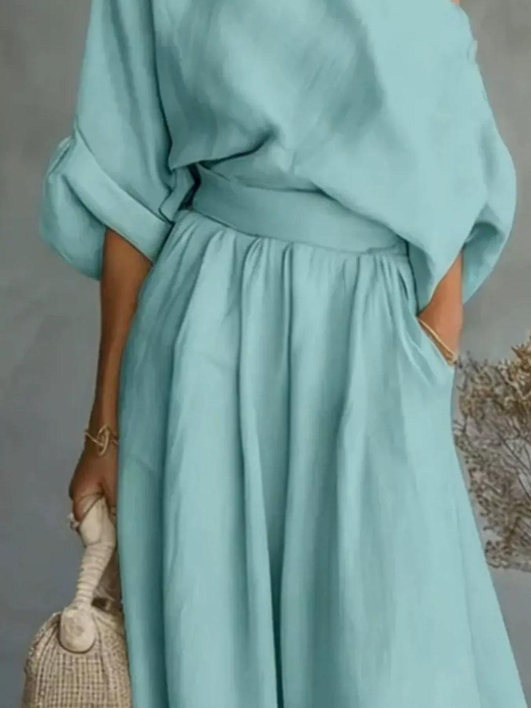 Sky blue one shoulder top and flowing maxi pants, closer view
