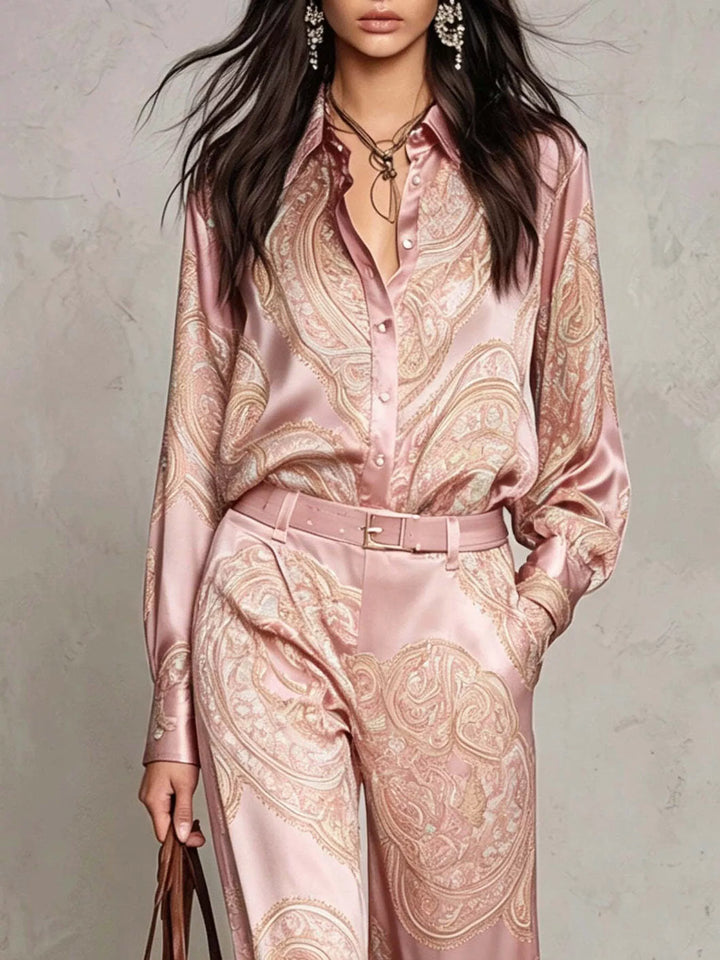 Close-up of the blush pink paisley shirt collar and belted waist