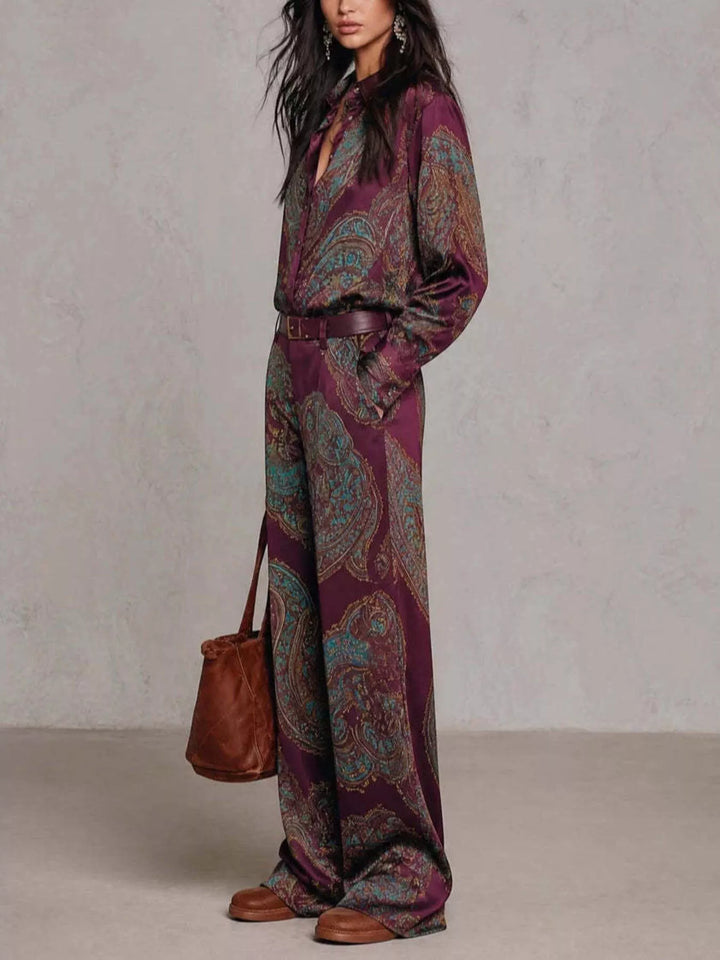 Burgundy paisley matching set worn with a brown leather tote, hand in pocket