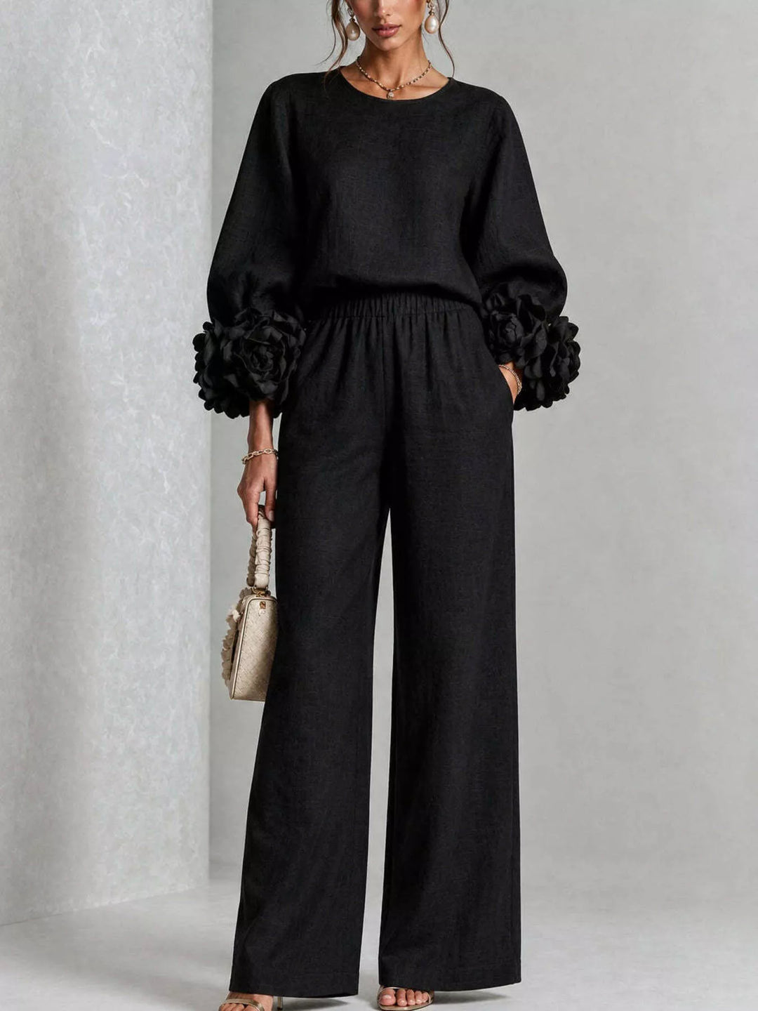 Black puff sleeve top and wide leg pants set, front view