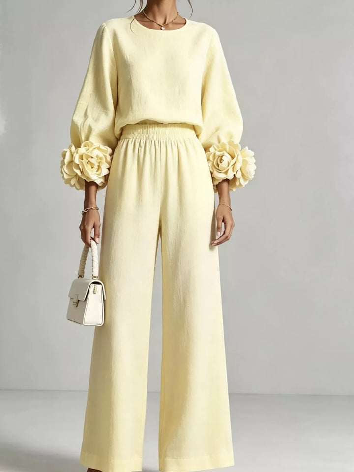 Pastel yellow matching set with rose cuff puff sleeves and wide leg pants