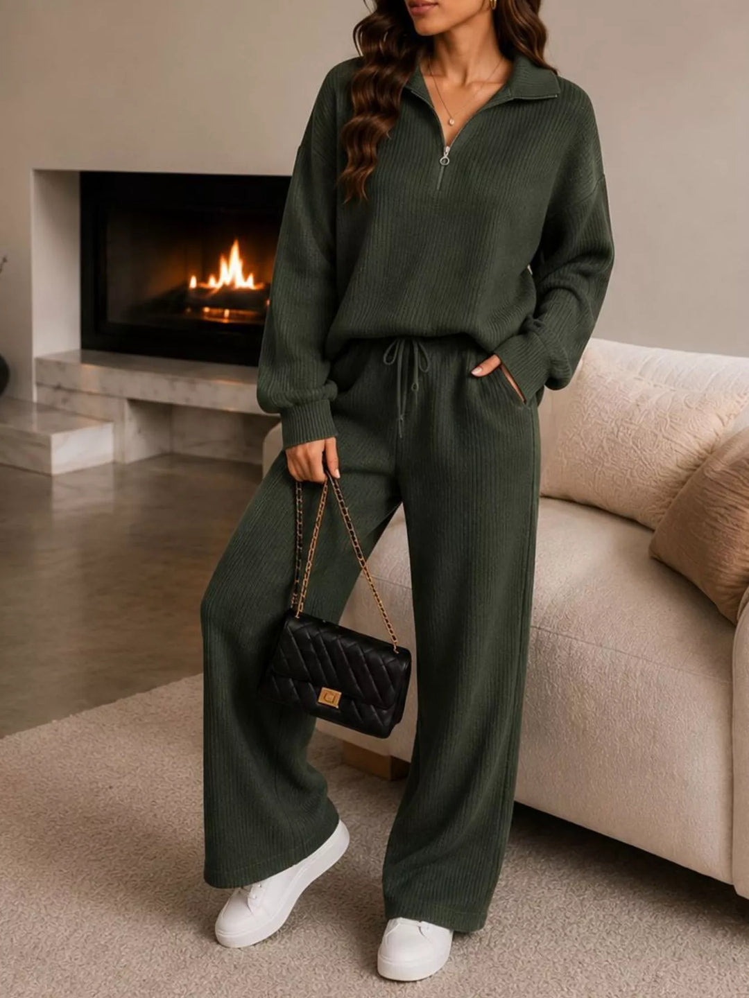 Dark green ribbed half zip set with wide leg pants, front view with a bag