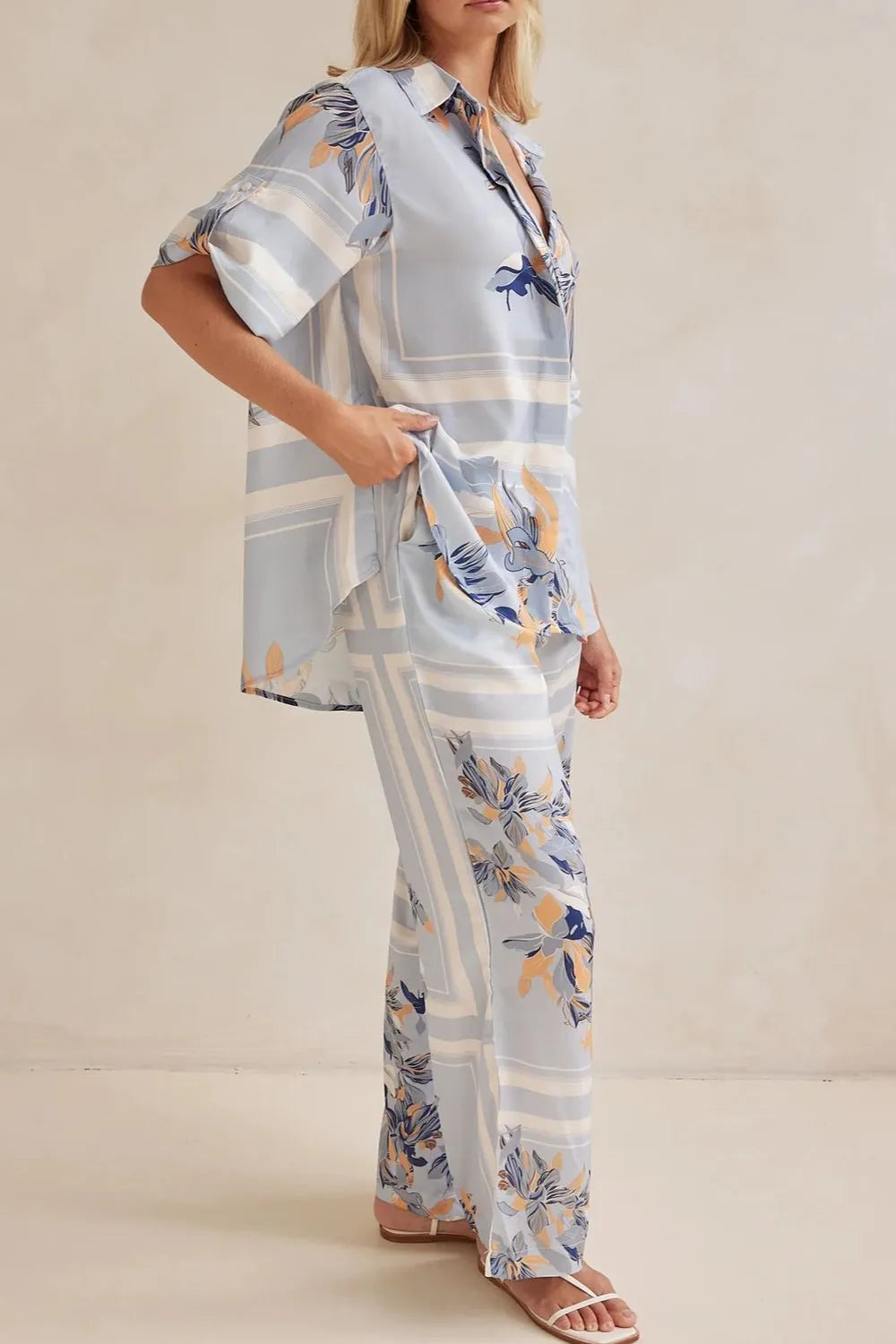 Side angle of the light blue floral shirt and pants set