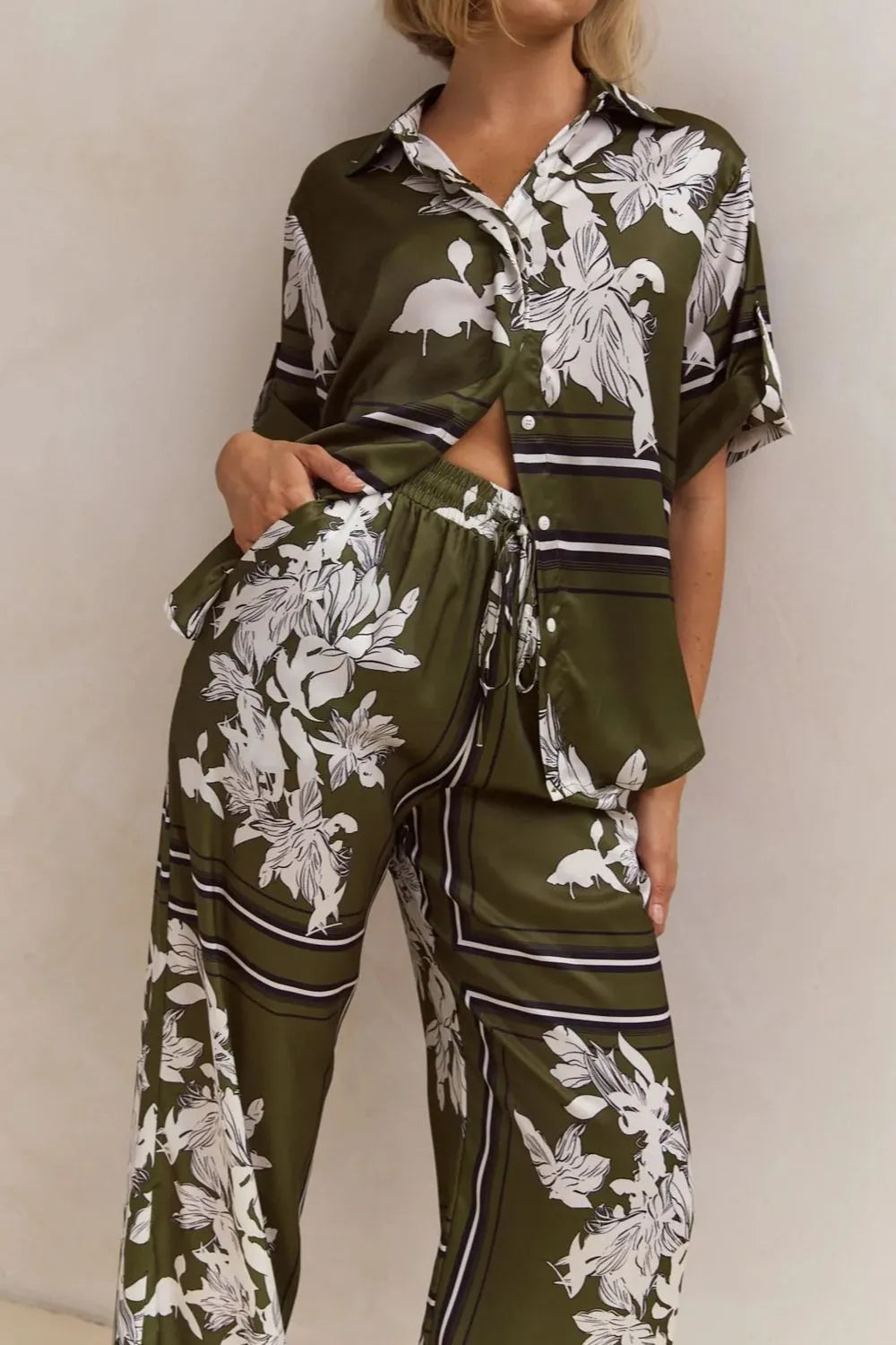 Olive floral pants and shirt set showing the drawstring waist and straight hem