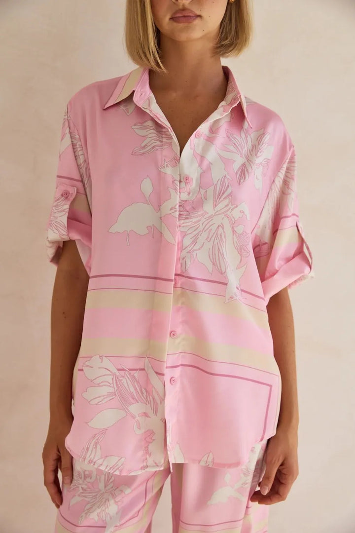 Pink floral button up shirt and pants front view with relaxed fit