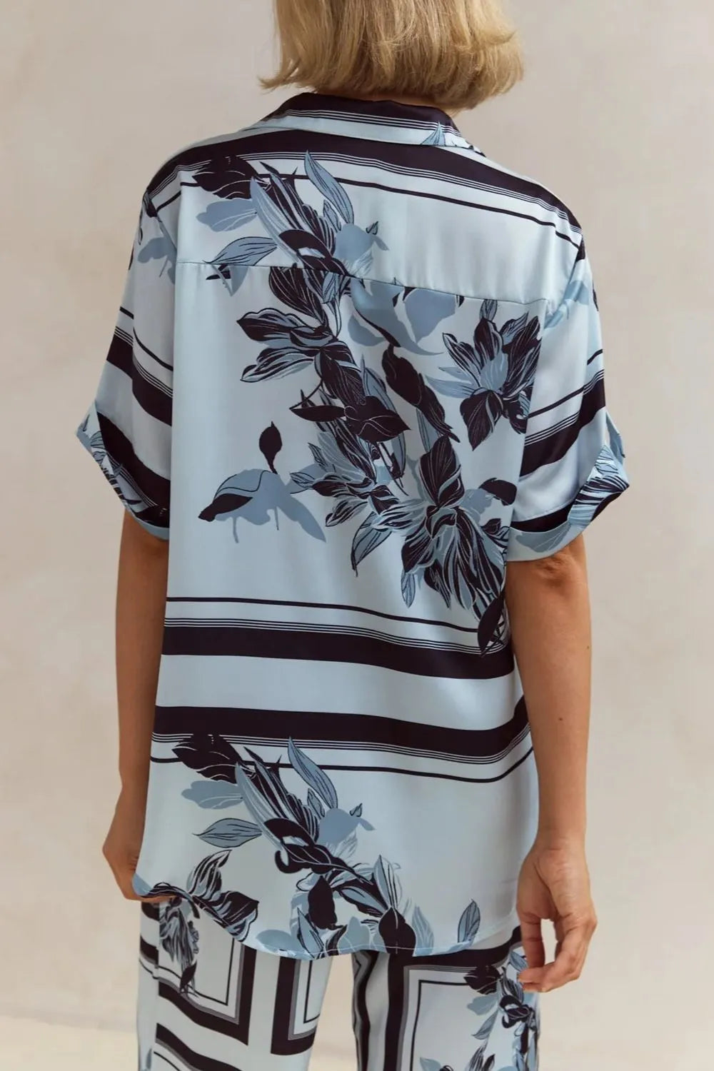 Back of the sky blue print shirt with navy leaf design and stripes