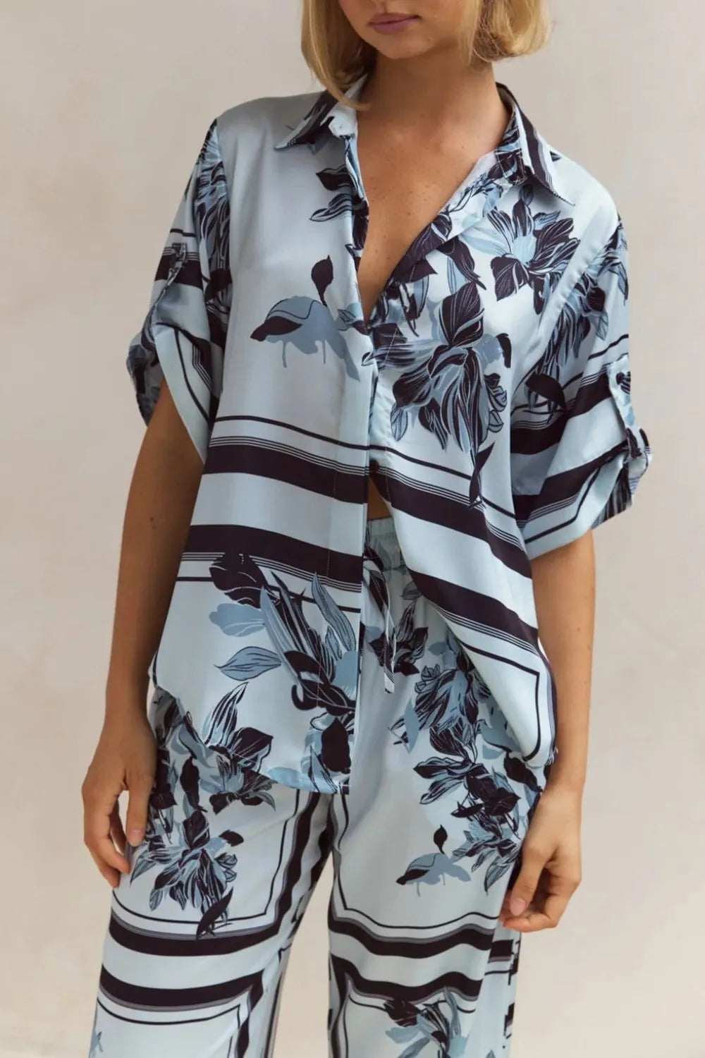 Sky blue print satin look shirt and pants set in a close front view