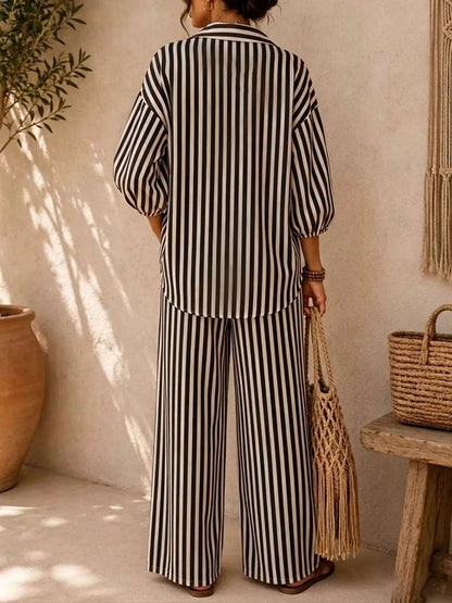 Back view of the black stripe shirt and wide leg pants matching set