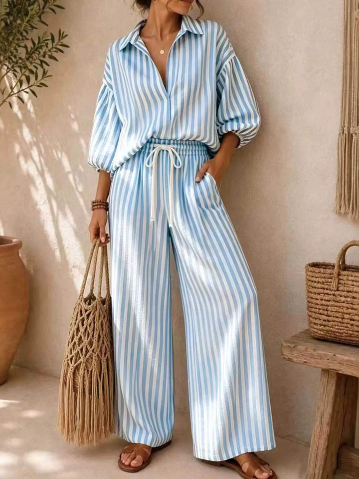 Light blue striped shirt and wide leg pants set styled with sandals
