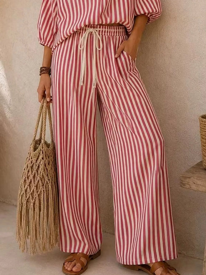 Rose red striped wide leg pants with drawstring and a woven tote