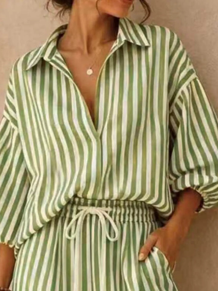 Close-up of the sage striped shirt with open collar and drawstring waist