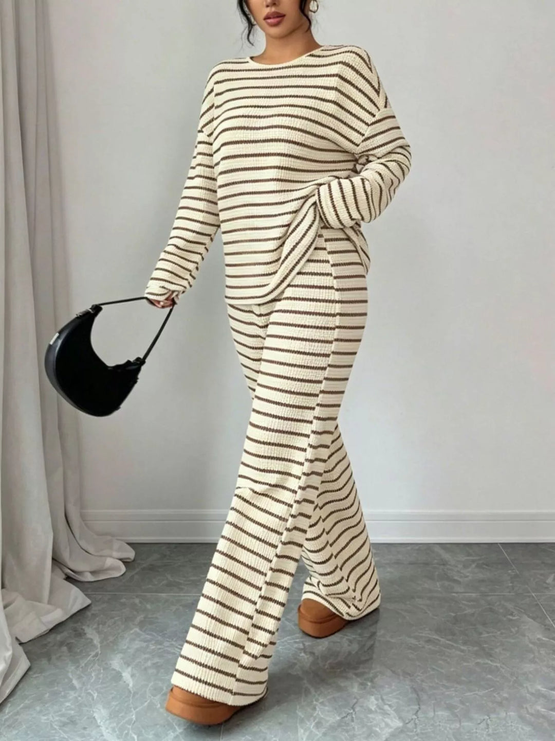 Striped waffle knit top and wide leg pants in apricot, styled on model 2