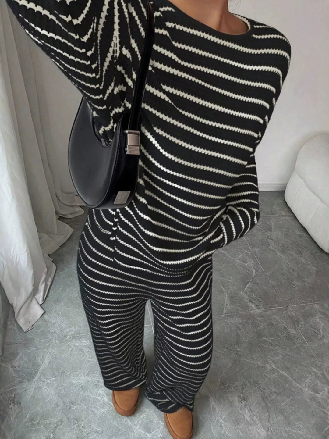 Striped waffle knit top and wide leg pants in black, close-up detail