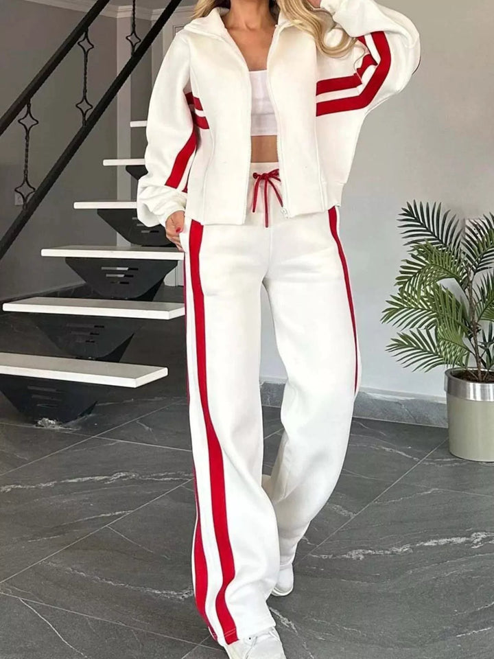 White matching tracksuit set with red stripes, zip up jacket and pants