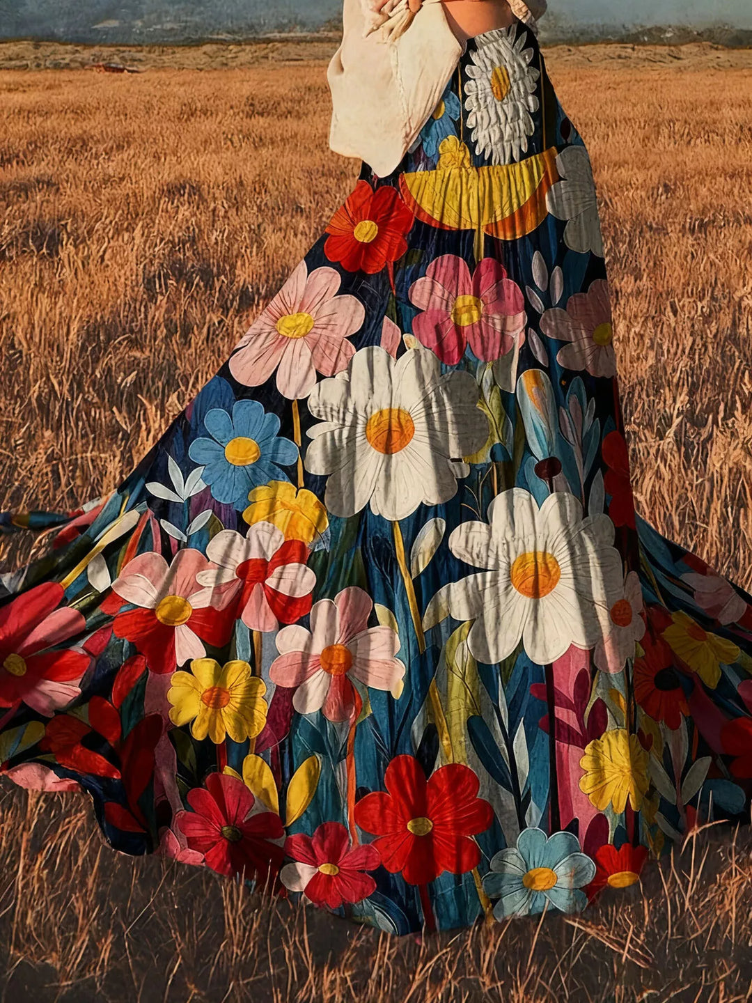 Floral tiered maxi skirt flowing in motion, showing large painted blooms