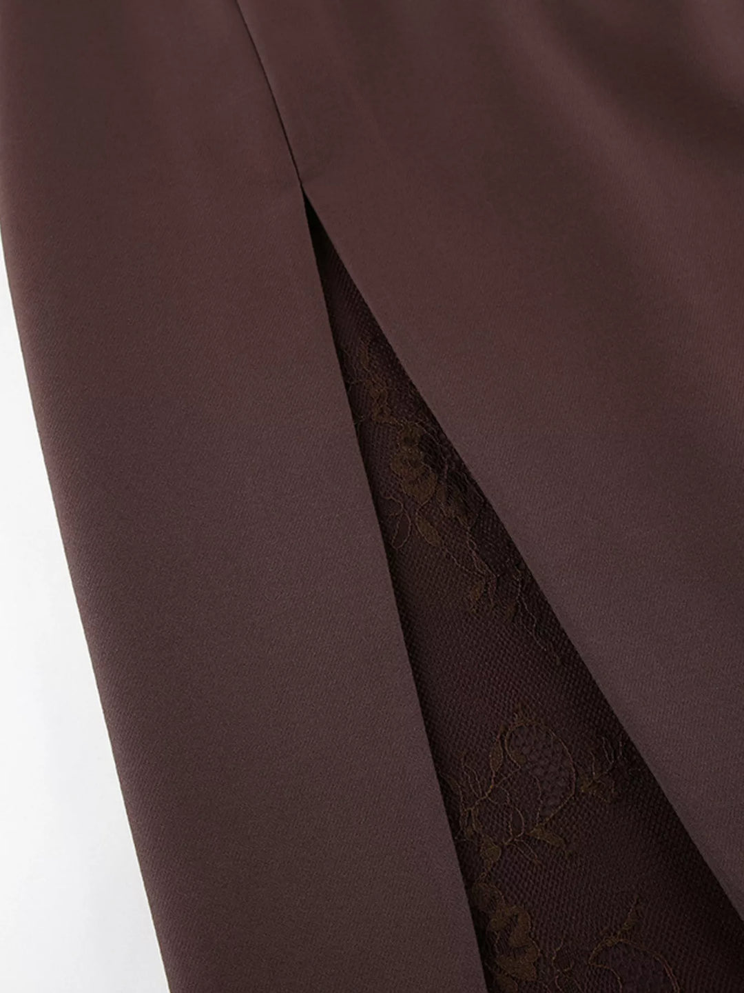 Close-up of the front slit with dark lace lining on the brown skirt