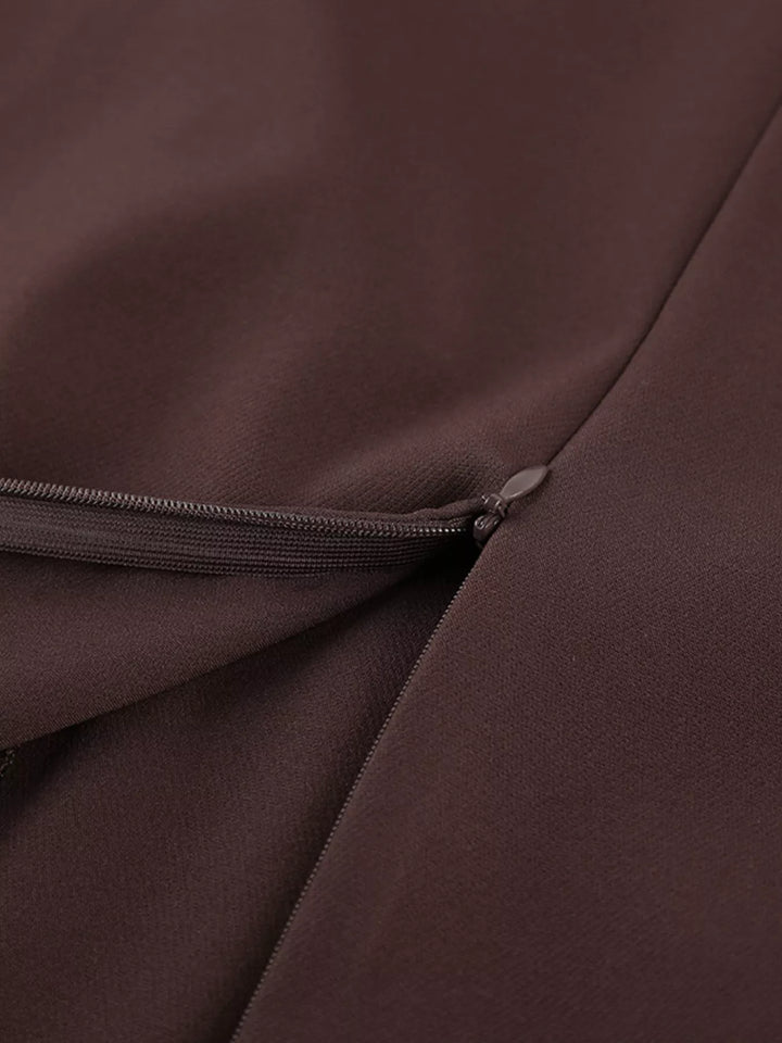 Brown maxi skirt waist detail with a belt loop and front fold