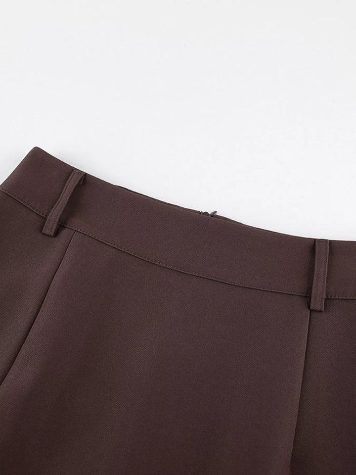 Detail of the waistband and belt loops on the brown maxi skirt