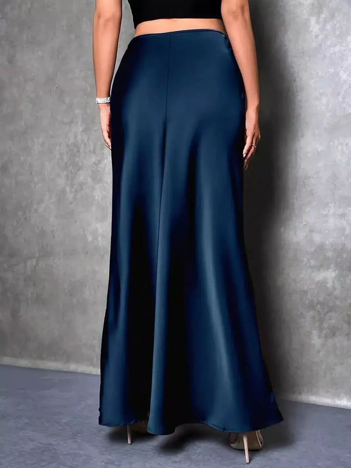 Back view of the peacock blue high waisted maxi skirt with a smooth fit