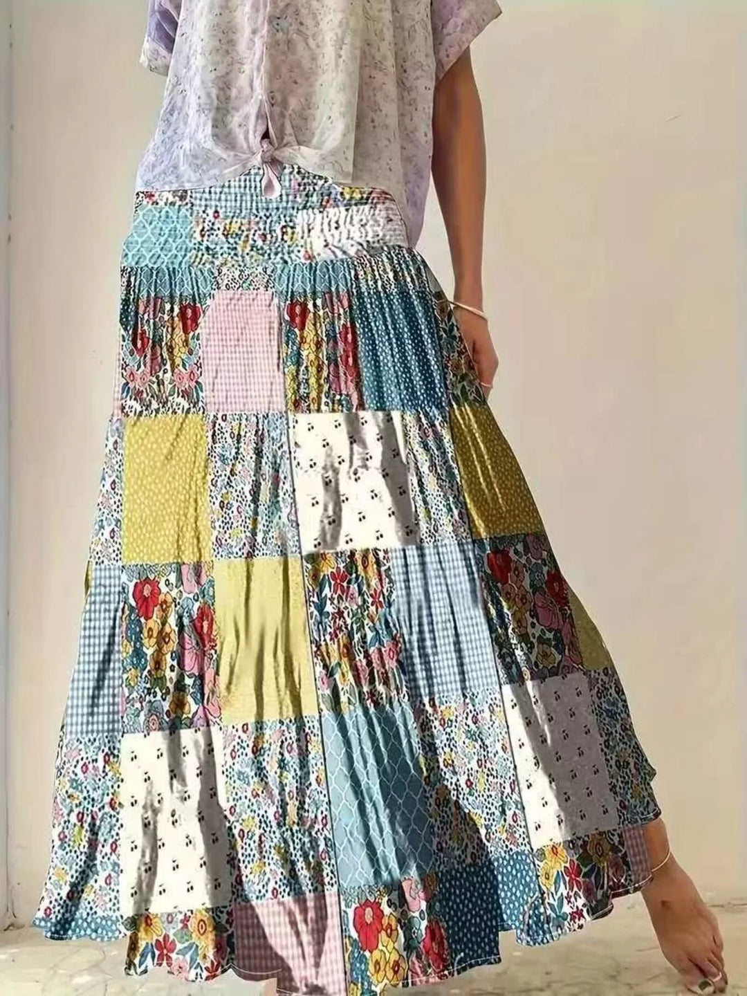 Floral patchwork tiered maxi skirt with smocked waist, close three quarter view