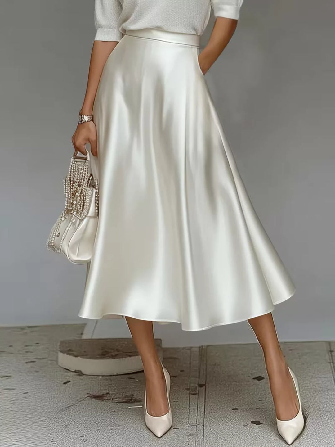 Back view of the ivory high waisted satin look midi skirt