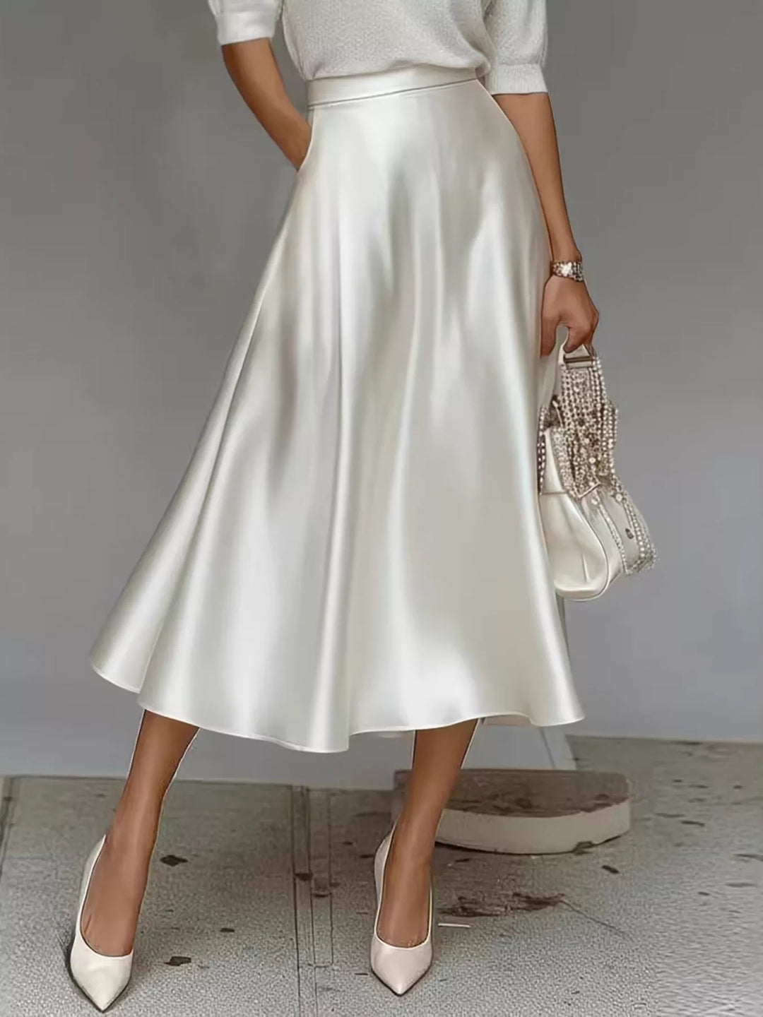 Ivory satin look A line midi skirt, high waisted, worn with a white top