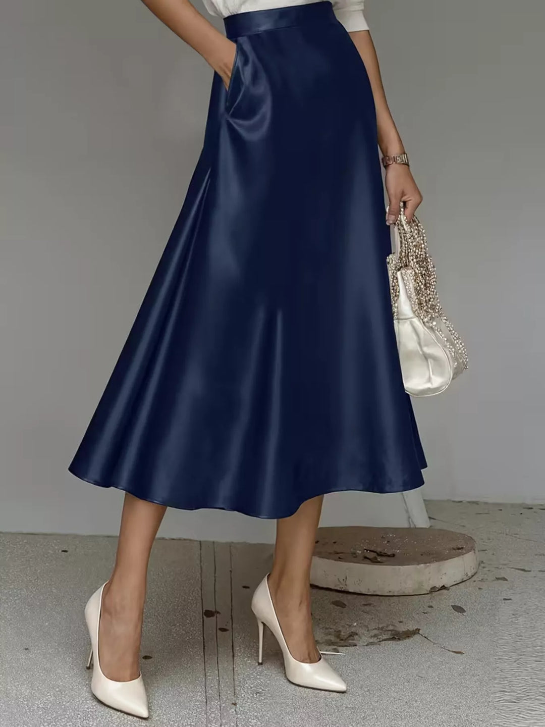 Navy high waisted A line midi skirt in a satin look, front view