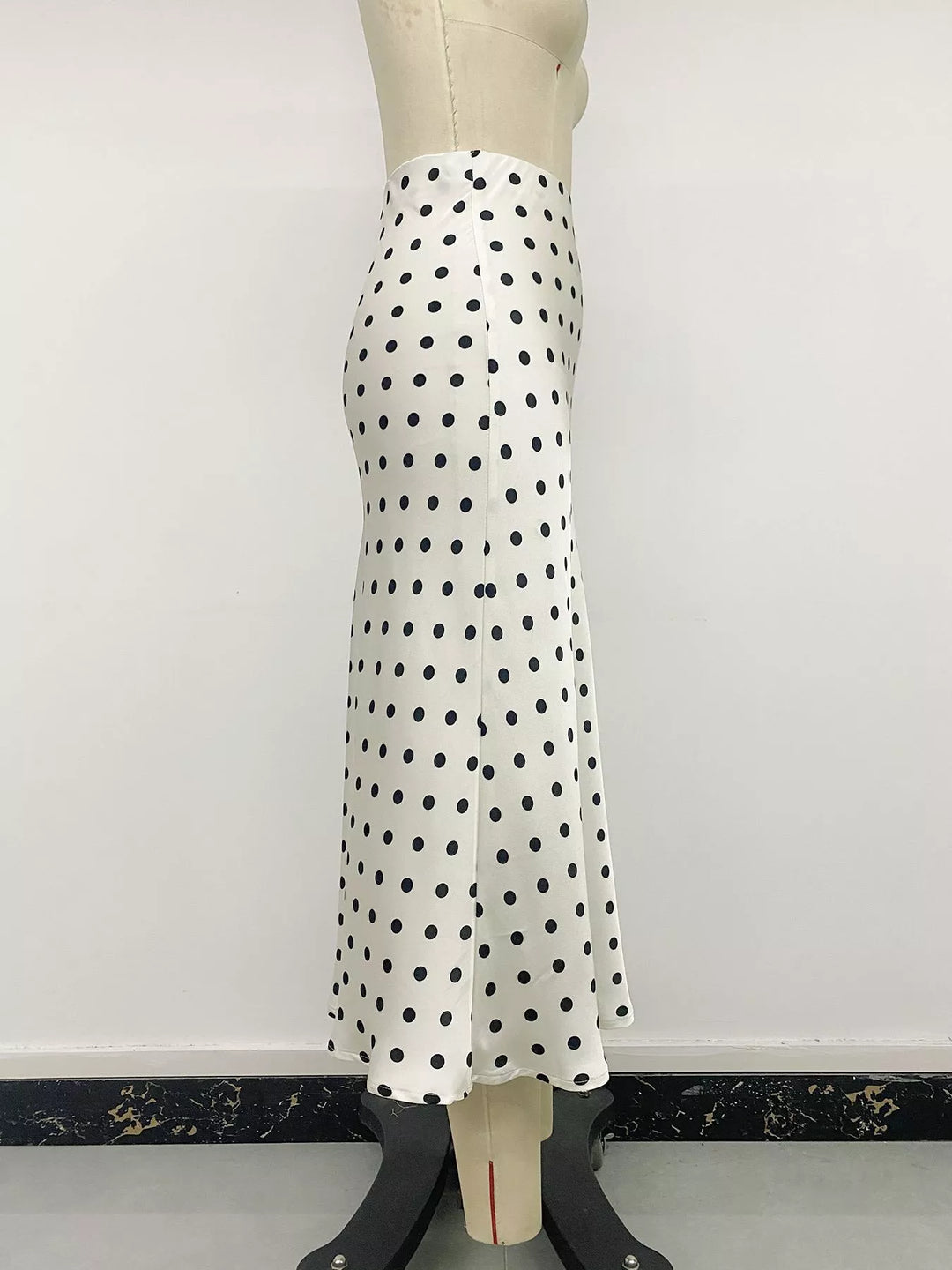 Cream polka dot midi skirt side view on a mannequin