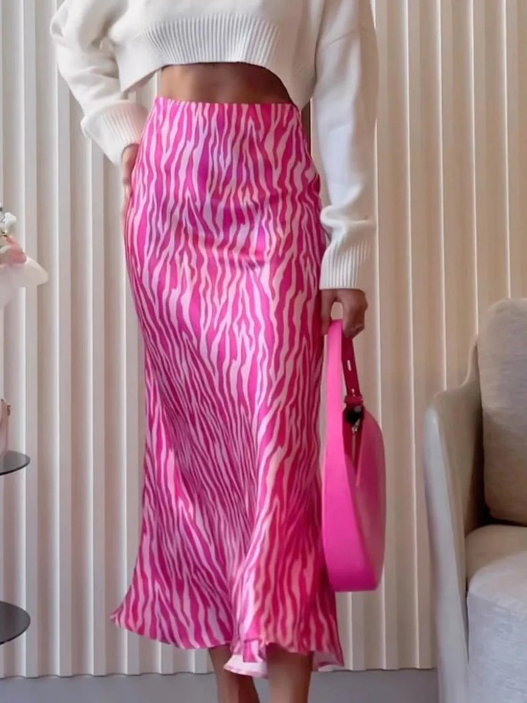 Hot pink zebra print skirt with a matching pink shoulder bag