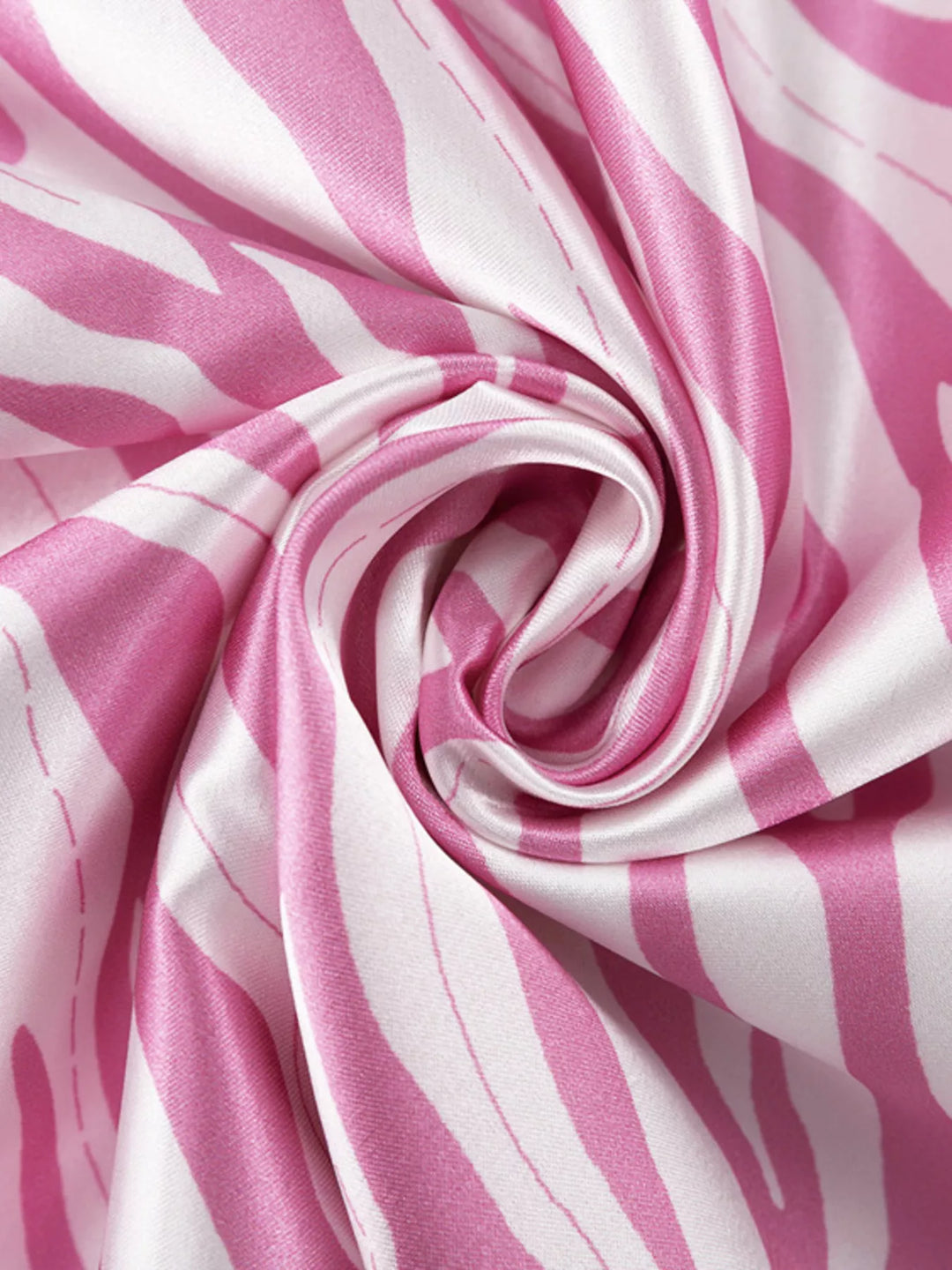 Close-up of the swirled light pink zebra print satin-look fabric