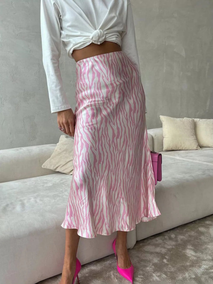 Full length light pink flared hem midi skirt with pink pumps